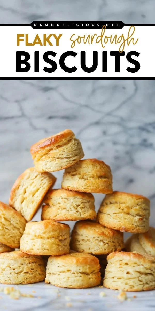 Freshly baked sourdough biscuits on a rustic wooden table