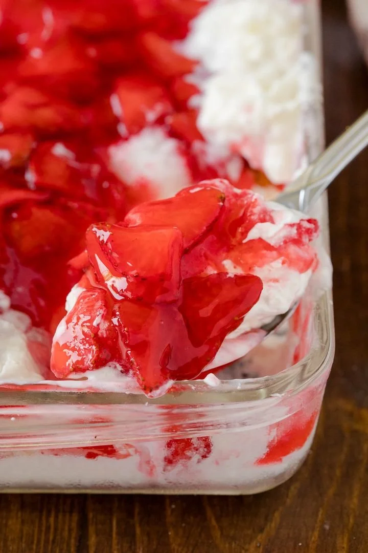 Strawberries nestled in snowy white backdrop showcasing winter beauty