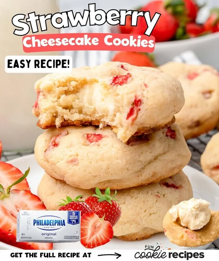 Strawberry cheesecake cookies on a plate with fresh strawberries and cheesecake topping