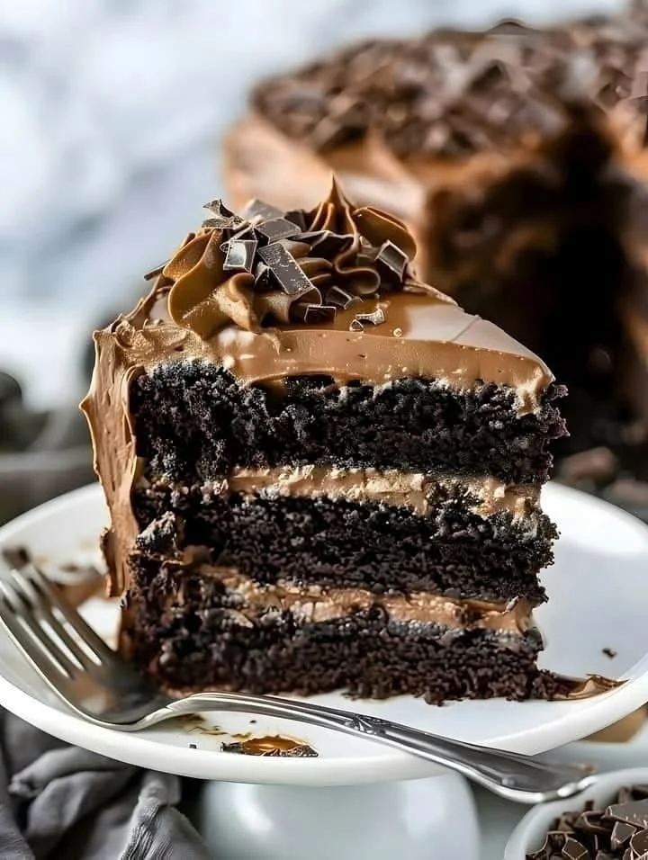 Delicious Triple Chocolate Cake with rich chocolate layers and frosting